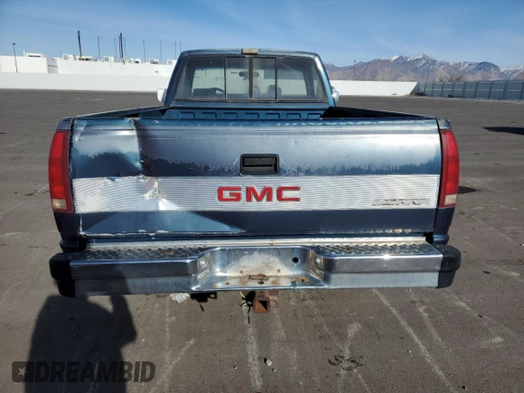 1990 GMC Sierra 1500 with VIN 1GTFC24K2LE554012, listed as a Copart auction lot 86004084 with 174,771 mi miles and Clean Title. Bid and sale history available at DreamBid. Image 6.