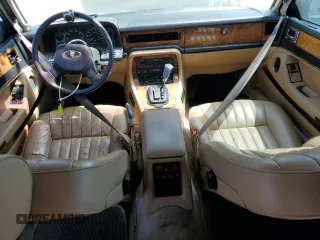 1992 Jaguar XJ with VIN SAJHY174XNC649368, listed as a Copart auction lot 50191454 with 99,553 mi miles and Salvage Title. Bid and sale history available at DreamBid. Image 8.