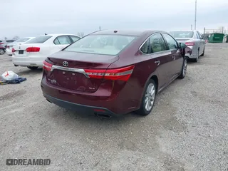 2014 Toyota Avalon Limited with VIN 4T1BK1EB5EU124568, listed as a IAAI auction lot 41996280 with 102,440 mi miles. Bid and sale history available at carsss.com. Image 4.