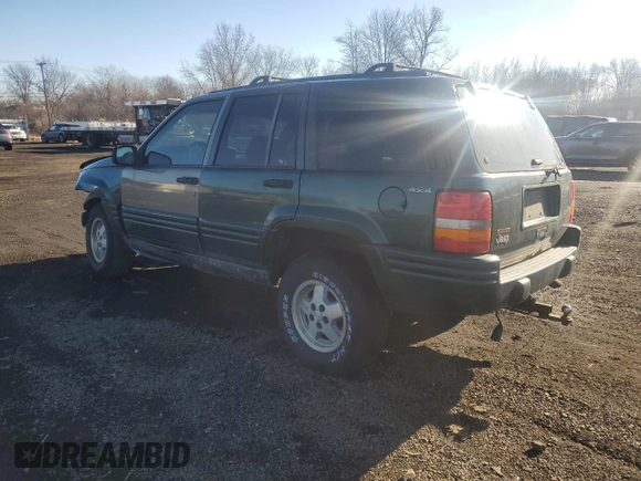 1998 Jeep Grand Cherokee Laredo with VIN 1J4GZ48S4WC239246, listed as a Copart auction lot 86101204 with 0 mi miles and Salvage Title. Bid and sale history available at carsss.com. Image 2.