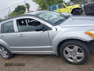 2009 Dodge Caliber SXT with VIN 1B3HB48A59D143888, listed as a IAAI auction lot 42110334 with 182,674 mi miles and . Bid and sale history available at DreamBid. Image 14.