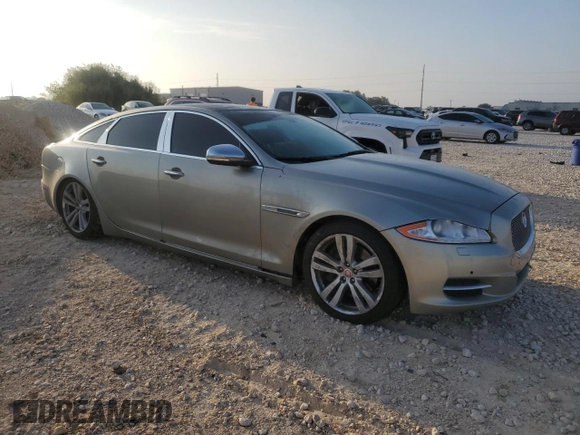 2014 Jaguar XJ Portfolio with VIN SAJWJ2GD7E8V61558, listed as a Copart auction lot 66850034 with 130,984 mi miles and Salvage title. Bid and sale history available at DreamBid. Image 4.