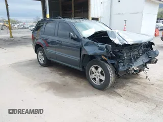 2007 Jeep Grand Cherokee Laredo with VIN 1J8GR48K07C692148, listed as a IAAI auction lot 42079608 with 245,605 mi miles. Bid and sale history available at carsss.com. Image 1.