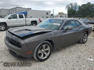2015 Dodge Challenger SXT with VIN 2C3CDZAG4FH728088, listed as a Copart auction lot 52515645 with 128,104 mi miles and Salvage Title. Bid and sale history available at carsss.com. Image 1.