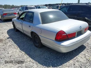 2001 Mercury Grand Marquis GS z VIN 2MEFM74W71X671429, wystawiony jako IAAI lot #41684570 z przebiegiem 155 334 mil mil oraz . Historia ofert i sprzedaży dostępna na DreamBid. Obrazek 3.