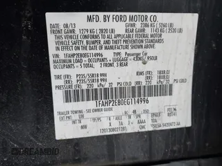 2014 Ford Taurus SEL with VIN 1FAHP2E80EG114996, listed as a IAAI auction lot 41908983 with 136,864 mi miles. Bid and sale history available at carsss.com. Image 9.