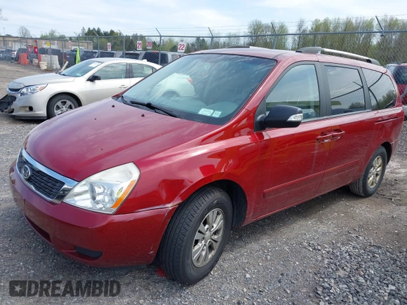 2012 Kia Sedona LX with VIN KNDMG4C71C6493153, listed as a IAAI auction lot 42176426 with 122,375 mi miles. Bid and sale history available at carsss.com. Image 2.