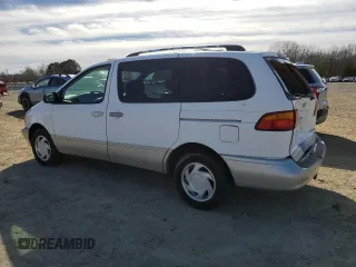 1999 Toyota Sienna LE with VIN 4T3ZF13C0XU144476, listed as a Copart auction lot 48185235 with 183,940 mi miles and Salvage title. Bid and sale history available at DreamBid. Image 2.