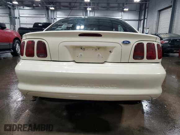 1996 Ford Mustang with VIN 1FALP4045TF168100, listed as a Copart auction lot 60464845 with 116,702 mi miles and Salvage title. Bid and sale history available at DreamBid. Image 6.