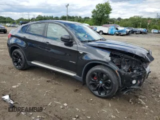 2012 BMW X6 50i z VIN 5UXFG8C51CLZ97393, wystawiony jako Copart lot #58407285 z przebiegiem 128 040 mil mil oraz Szkoda całkowita • Salvage title. Historia ofert i sprzedaży dostępna na DreamBid. Obrazek 4.