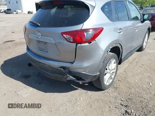 2014 Mazda CX-5 Grand Touring with VIN JM3KE4DY7E0311893, listed as a IAAI auction lot 42090872 with 102,154 mi miles and . Bid and sale history available at DreamBid. Image 17.