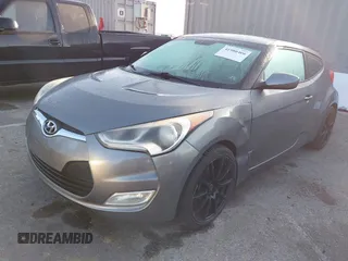 2012 Hyundai Veloster w/Gray Int z VIN KMHTC6AD1CU082872, wystawiony jako IAAI lot #41980406 z przebiegiem 132 804 mil mil oraz . Historia ofert i sprzedaży dostępna na DreamBid. Obrazek 2.
