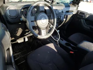 2014 Jeep Wrangler Sport z VIN 1C4AJWAG0EL119835, wystawiony jako Copart lot #88498755 z przebiegiem 151 756 mil mil oraz Szkoda całkowita • Salvage title. Historia ofert i sprzedaży dostępna na DreamBid. Obrazek 8.