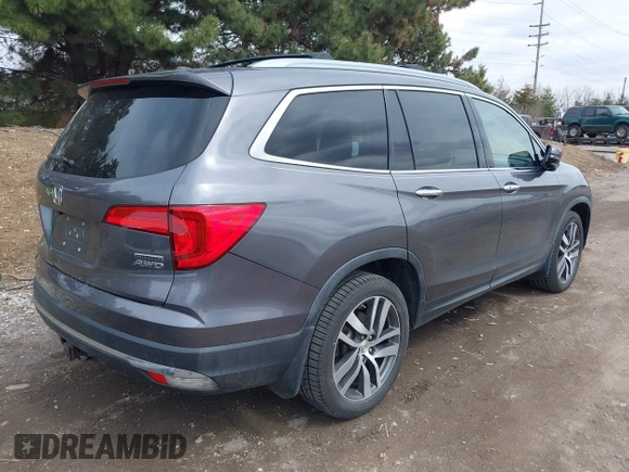 2017 Honda Pilot Touring with VIN 5FNYF6H92HB012090, listed as a IAAI auction lot 41882542 with 110,179 mi miles and . Bid and sale history available at DreamBid. Image 4.
