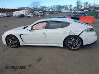 2014 Porsche Panamera S E-Hybrid with VIN WP0AD2A76EL044722, listed as a IAAI auction lot 40716615 with 52,474 mi miles and . Bid and sale history available at DreamBid. Image 14.