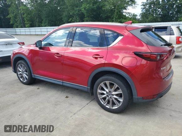 2019 Mazda CX-5 Grand Touring with VIN JM3KFADM2K1657915, listed as a Copart auction lot 56647145 with 85,095 mi miles and Salvage title. Bid and sale history available at DreamBid. Image 2.