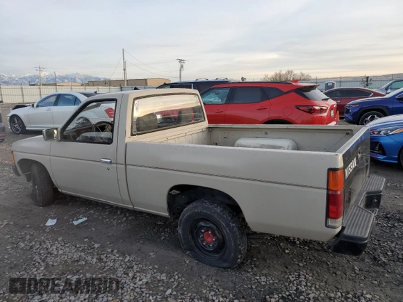 1986 Nissan Hardbody E z VIN JN6ND11S1GW037479, wystawiony jako Copart lot #81775934 z przebiegiem 389 841 mil mil oraz Szkoda całkowita • Salvage title. Historia ofert i sprzedaży dostępna na DreamBid. Obrazek 2.