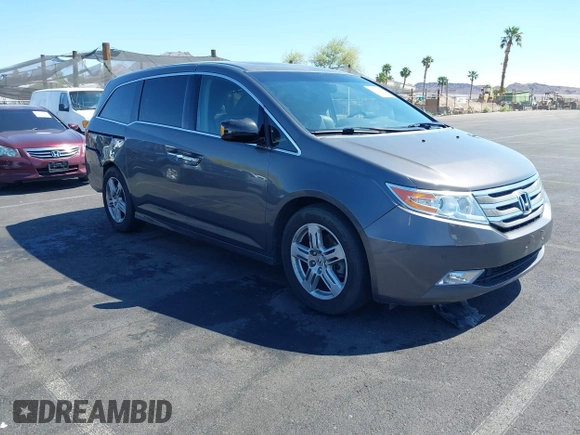 2013 Honda Odyssey Touring with VIN 5FNRL5H95DB045666, listed as a IAAI auction lot 42117219 with 50,715 mi miles and . Bid and sale history available at carsss.com. Image 1.