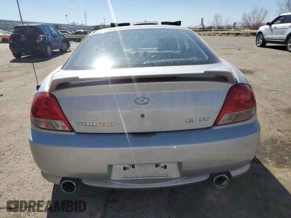 2006 Hyundai Tiburon GT z VIN KMHHN65F76U190851, wystawiony jako Copart lot #45935795 z przebiegiem 102 335 mil mil oraz Szkoda całkowita • Salvage title. Historia ofert i sprzedaży dostępna na DreamBid. Obrazek 6.