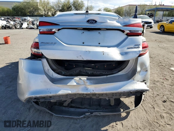 2018 Ford Fusion SE z VIN 3FA6P0LU7JR139974, wystawiony jako Copart lot #69819394 z przebiegiem 164 123 mil mil oraz Szkoda całkowita • Salvage title. Historia ofert i sprzedaży dostępna na DreamBid. Obrazek 6.