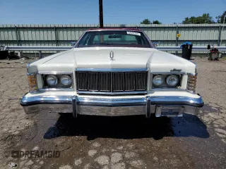 1977 Mercury Grand Marquis z VIN 7Z60A610691, wystawiony jako Copart lot #64587354 z przebiegiem 20 203 mil mil oraz Tytuł czysty. Historia ofert i sprzedaży dostępna na DreamBid. Obrazek 5.