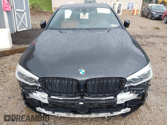 2018 BMW 5 Series M550i xDrive with VIN WBAJB9C5XJB286923, listed as a IAAI auction lot 42527301 with 76,923 mi miles and . Bid and sale history available at DreamBid. Image 12.