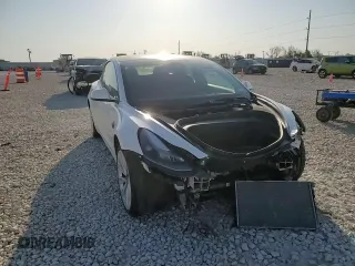 2023 Tesla Model 3 with VIN 5YJ3E1EA4PF631304, listed as a Copart auction lot 52500695 with 33,024 mi miles and Salvage title. Bid and sale history available at DreamBid. Image 11.