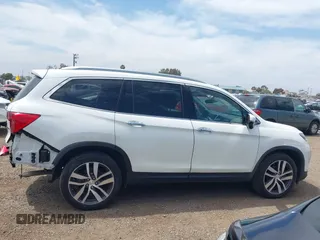2017 Honda Pilot Touring with VIN 5FNYF5H95HB042632, listed as a IAAI auction lot 42011885 with 103,321 mi miles. Bid and sale history available at carsss.com. Image 14.