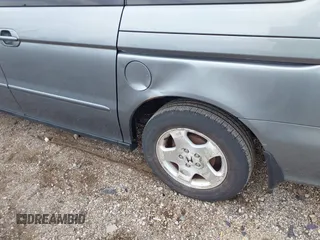 2000 Honda Odyssey EX z VIN 2HKRL1879YH516264, wystawiony jako IAAI lot #42109480 z przebiegiem 214 414 mil mil oraz . Historia ofert i sprzedaży dostępna na DreamBid. Obrazek 6.
