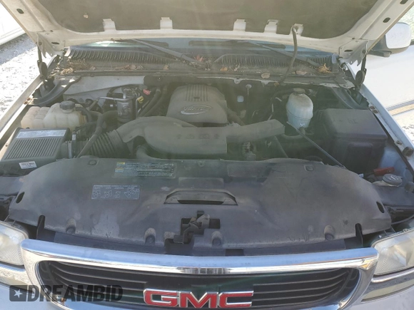 2005 GMC Yukon SLE with VIN 1GKEC13T15J230550, listed as a Copart auction lot 77214624 with 203,095 mi miles and Salvage Title. Bid and sale history available at carsss.com. Image 12.