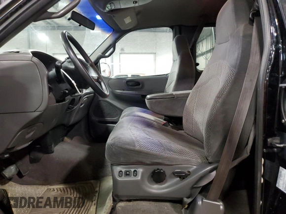 2000 Ford F-150 XL with VIN 1FTRX18L7YNA85909, listed as a Copart auction lot 56056165 with 134,765 mi miles and Salvage title. Bid and sale history available at DreamBid. Image 7.