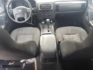 2004 Jeep Grand Cherokee Laredo with VIN 1J4GW48SX4C295133, listed as a Copart auction lot 45774445 with 284,306 mi miles and Salvage Title. Bid and sale history available at carsss.com. Image 8.