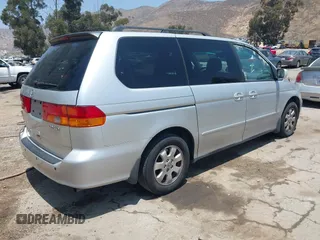 2004 Honda Odyssey EX-L with VIN 5FNRL18774B028164, listed as a IAAI auction lot 42454877 with 135,720 mi miles and . Bid and sale history available at DreamBid. Image 4.