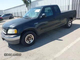 2003 Ford F-150 XL with VIN 1FTRX17213NB70553, listed as a IAAI auction lot 41946968 with 186,683 mi miles. Bid and sale history available at carsss.com. Image 2.