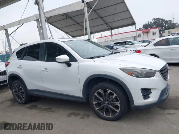 2016 Mazda CX-5 Grand Touring with VIN JM3KE4DY7G0737232, listed as a IAAI auction lot 42158279 with Not Provided miles and . Bid and sale history available at DreamBid. Image 13.
