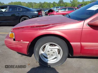 1996 Ford Thunderbird LX with VIN 1FALP62W0TH142986, listed as a IAAI auction lot 42030900 with 168,993 mi miles. Bid and sale history available at carsss.com. Image 20.