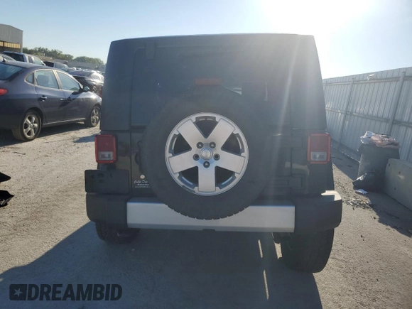 2010 Jeep Wrangler Sahara z VIN 1J4AA5D1XAL227305, wystawiony jako Copart lot #70165554 z przebiegiem Nie podano mil oraz Szkoda całkowita • Salvage title. Historia ofert i sprzedaży dostępna na DreamBid. Obrazek 6.