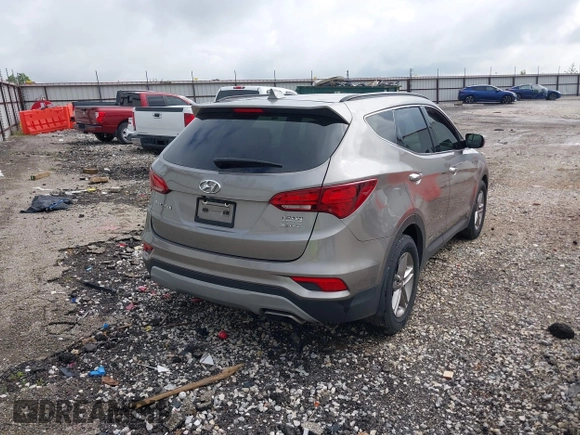 2018 Hyundai Santa Fe 2.4L with VIN 5NMZU3LB1JH100507, listed as a IAAI auction lot 42182116 with 103,826 mi miles and . Bid and sale history available at DreamBid. Image 4.