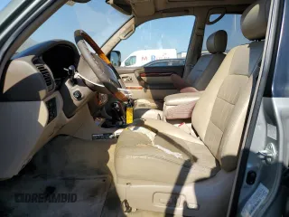 2002 Lexus LX 470 z VIN JTJHT00W723519186, wystawiony jako Copart lot #70190464 z przebiegiem 306 793 mil mil oraz Tytuł czysty. Historia ofert i sprzedaży dostępna na DreamBid. Obrazek 7.