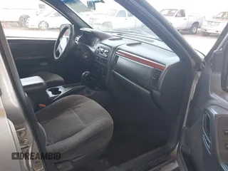1999 Jeep Grand Cherokee Laredo with VIN 1J4G258S7XC679151, listed as a IAAI auction lot 42500706 with Not provided miles and . Bid and sale history available at DreamBid. Image 5.