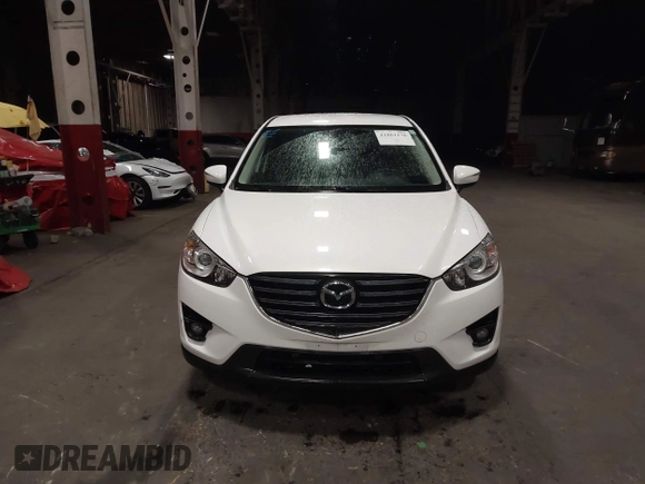 2016 Mazda CX-5 Touring z VIN JM3KE4CY0G0853261, wystawiony jako IAAI lot #41861176 z przebiegiem 63 491 mil mil oraz . Historia ofert i sprzedaży dostępna na DreamBid. Obrazek 12.