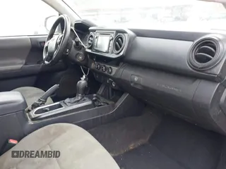 2018 Toyota Tacoma SR with VIN 5TFRX5GN9JX114752, listed as a IAAI auction lot 41313849 with 248,901 mi miles and . Bid and sale history available at DreamBid. Image 5.