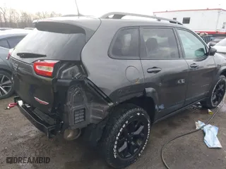 2018 Jeep Cherokee Trailhawk with VIN 1C4PJMBB3JD516090, listed as a IAAI auction lot 41460960 with 97,639 mi miles. Bid and sale history available at carsss.com. Image 4.