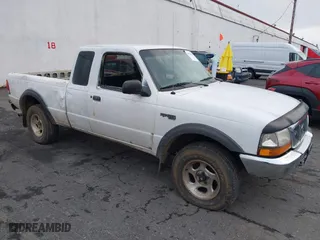 1999 Ford Ranger XLT with VIN 1FTZR15XXXTA09502, listed as a IAAI auction lot 41794904 with 203,276 mi miles. Bid and sale history available at carsss.com. Image 1.