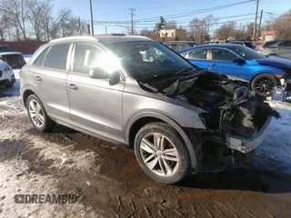 2017 Audi Q3 Premium with VIN WA1ECCFSXHR014173, listed as a IAAI auction lot 41637591 with 165,508 mi miles. Bid and sale history available at carsss.com. Image 1.