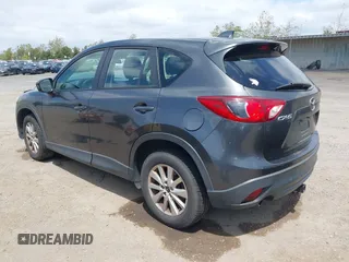 2014 Mazda CX-5 Sport with VIN JM3KE2BE0E0411377, listed as a IAAI auction lot 42143229 with 137,384 mi miles and . Bid and sale history available at carsss.com. Image 3.