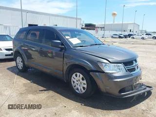 2015 Dodge Journey American Value z VIN 3C4PDCAB2FT637391, wystawiony jako IAAI lot #42354094 z przebiegiem 130 743 mil mil oraz . Historia ofert i sprzedaży dostępna na DreamBid. Obrazek 1.