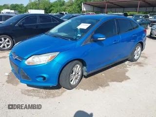 2014 Ford Focus SE with VIN 1FADP3F29EL122925, listed as a IAAI auction lot 42044004 with 216,490 mi miles. Bid and sale history available at carsss.com. Image 2.