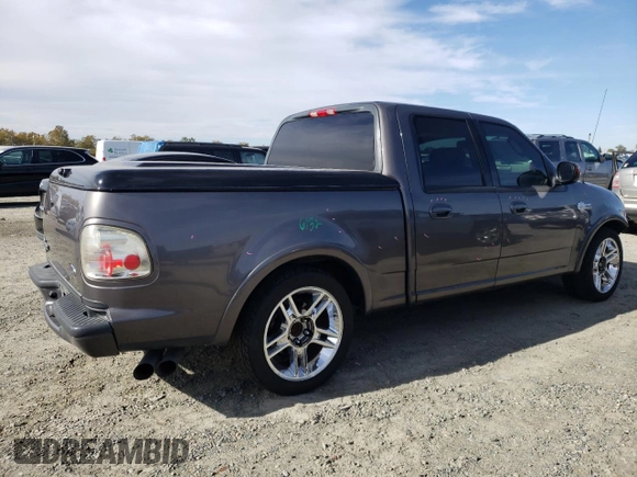2002 Ford F-150 Harley Davidson with VIN 1FTRW07342KC78218, listed as a Copart auction lot 78273304 with 217,968 mi miles and Salvage Title. Bid and sale history available at carsss.com. Image 3.