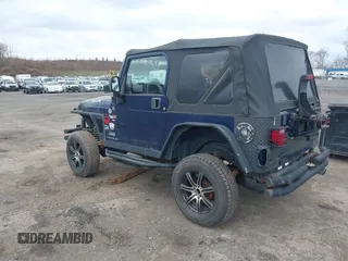 2004 Jeep Wrangler X with VIN 1J4FA39S64P780915, listed as a IAAI auction lot 42035524 with 131,057 mi miles. Bid and sale history available at carsss.com. Image 3.